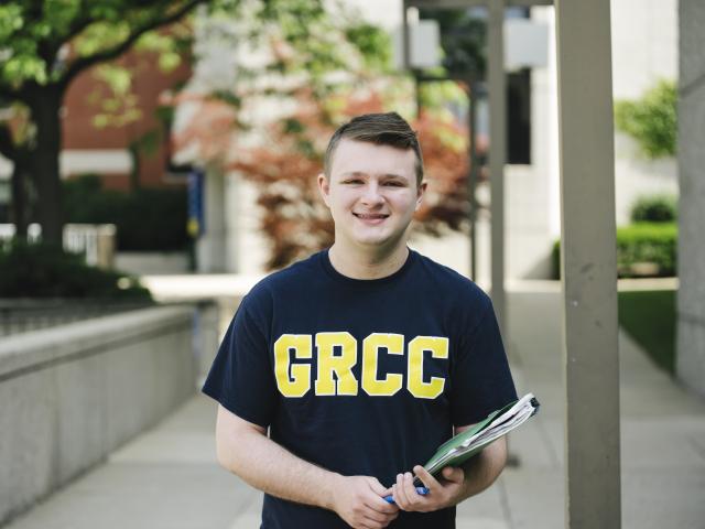 GRCC student outside the library